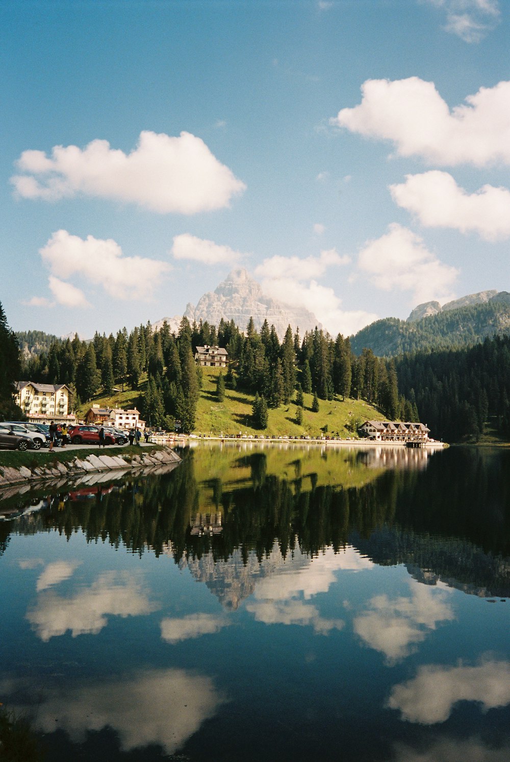 a body of water surrounded by mountains and trees