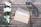 Elegant gift hamper with assorted treats and a thank you card on a wooden desk
