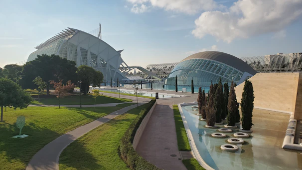 A bustling commercial complex featuring glass facades and landscaped surroundings, showcasing architectural finesse.