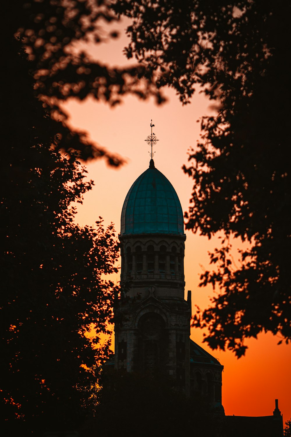 a building with a steeple and a cross on top