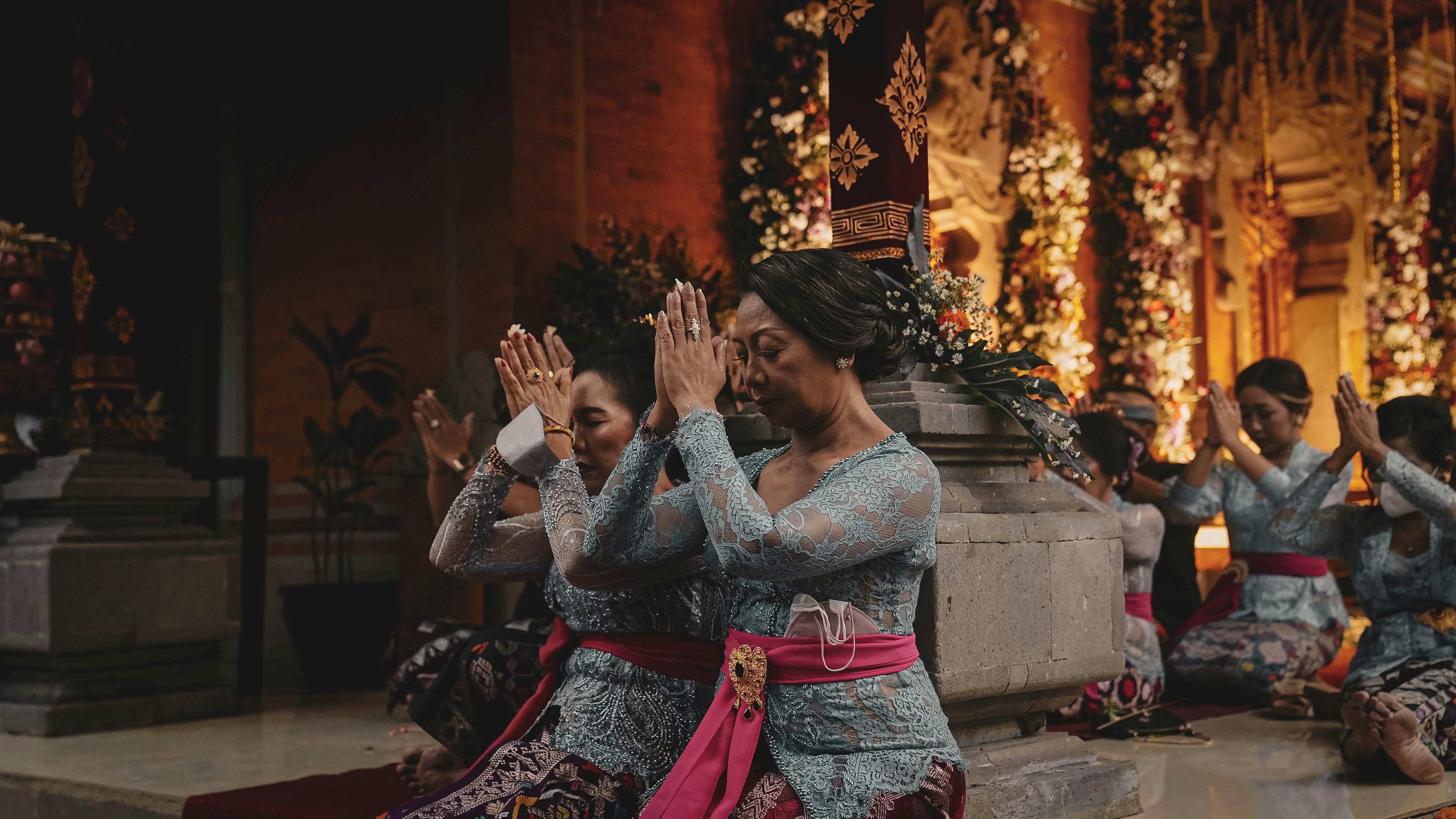 a group of women sitting on top of a floor next to each other, 