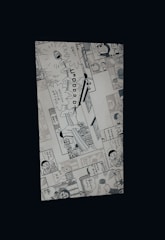 A manga page featuring various panels with illustrations and Japanese text. Characters include a robot cat and a young boy, engaged in dialogue and activities.