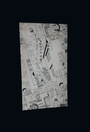 A manga page featuring various panels with illustrations and Japanese text. Characters include a robot cat and a young boy, engaged in dialogue and activities.
