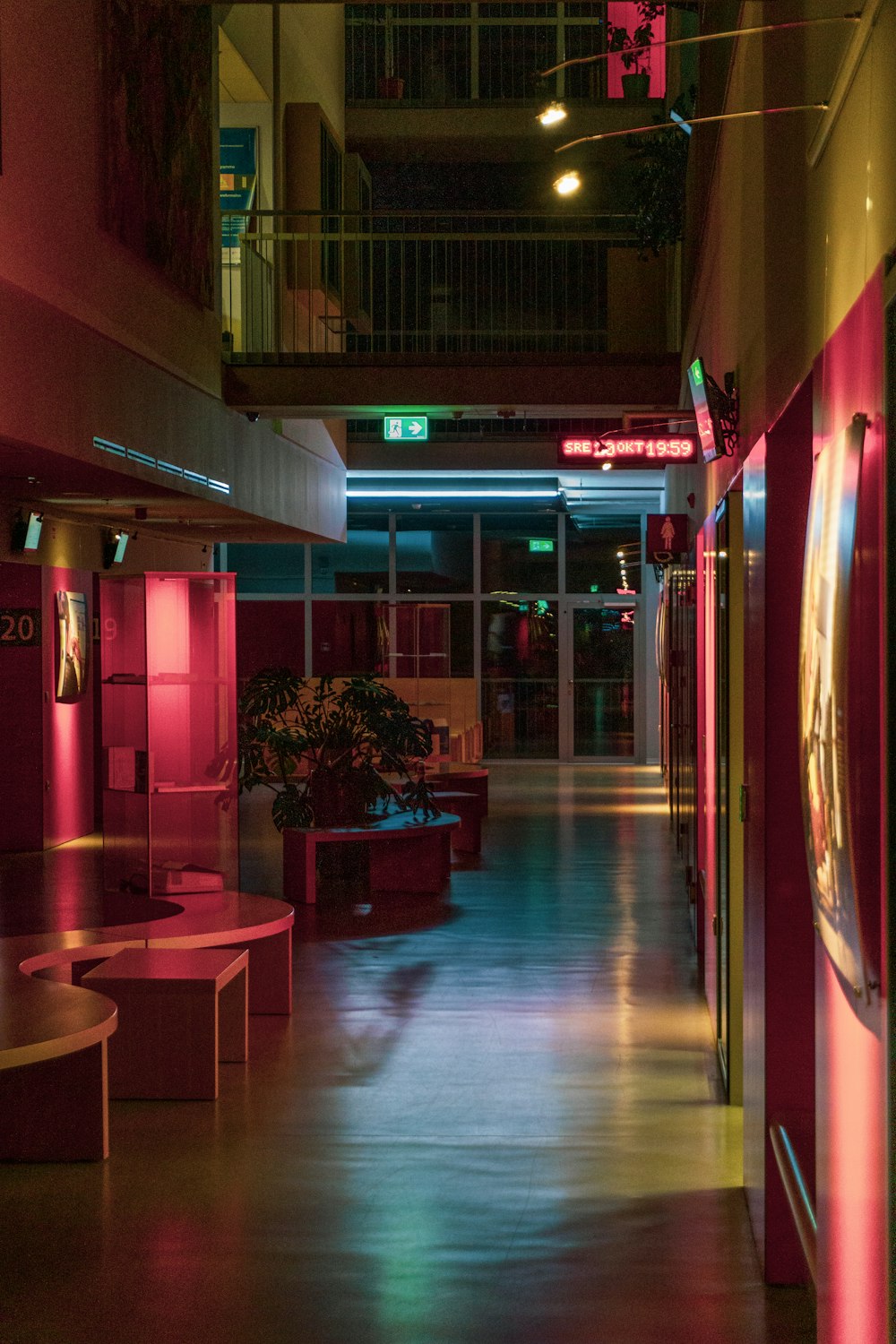 a long hallway with a clock on the wall