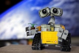 a lego robot with two eyes and a camera