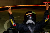 A vibrant moment of celebration as a driver crosses the virtual finish line.