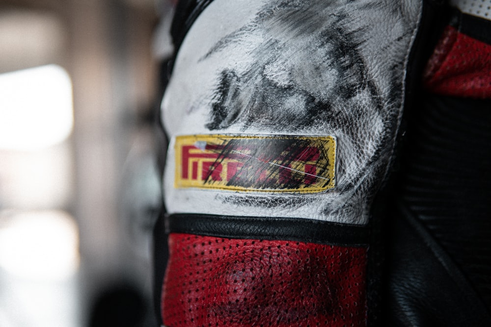 a close up of a red and black motorcycle jacket