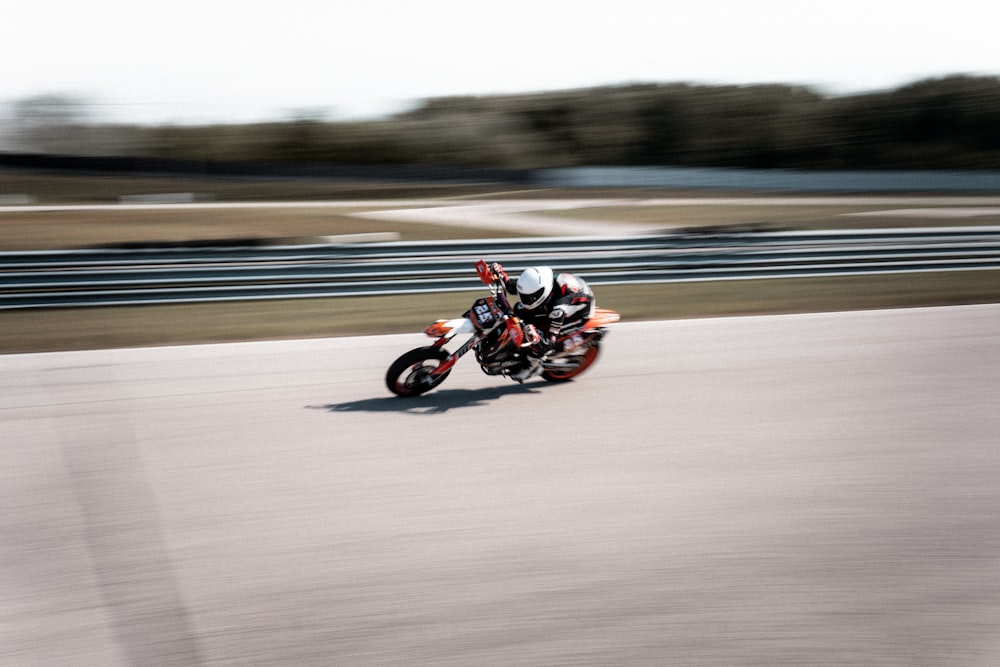 a person riding a motorcycle on a race track