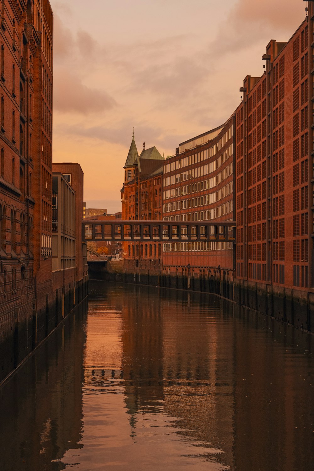 a river running through a city next to tall buildings