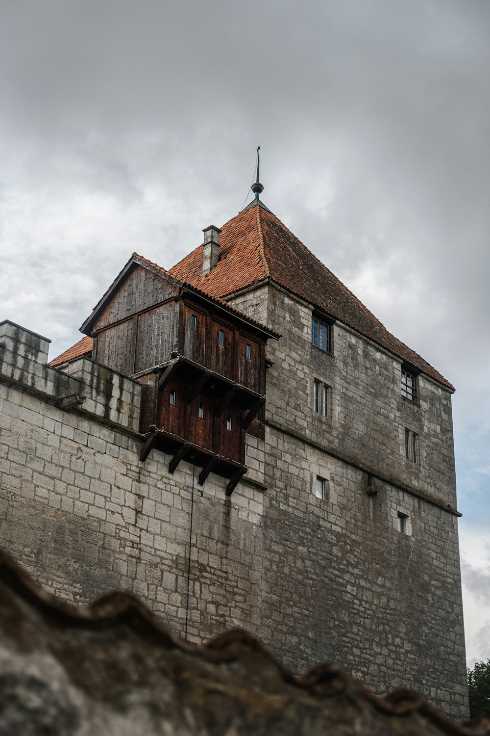 an old building with a red roof and a tower