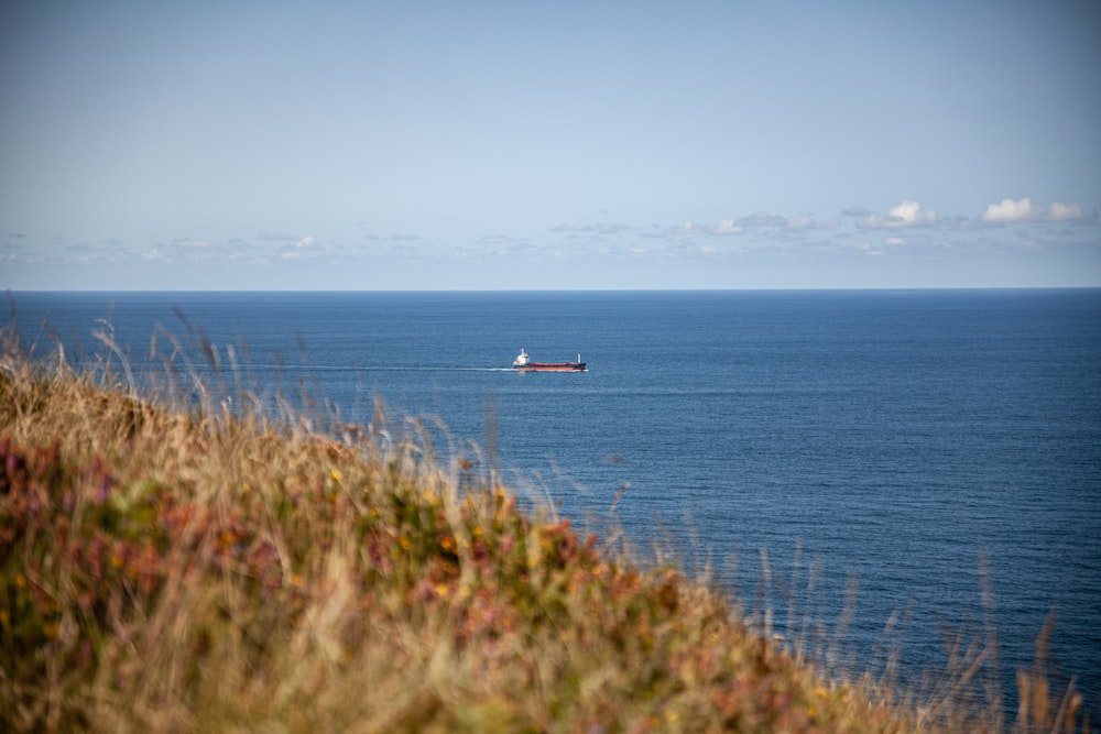 a boat is in the middle of the ocean