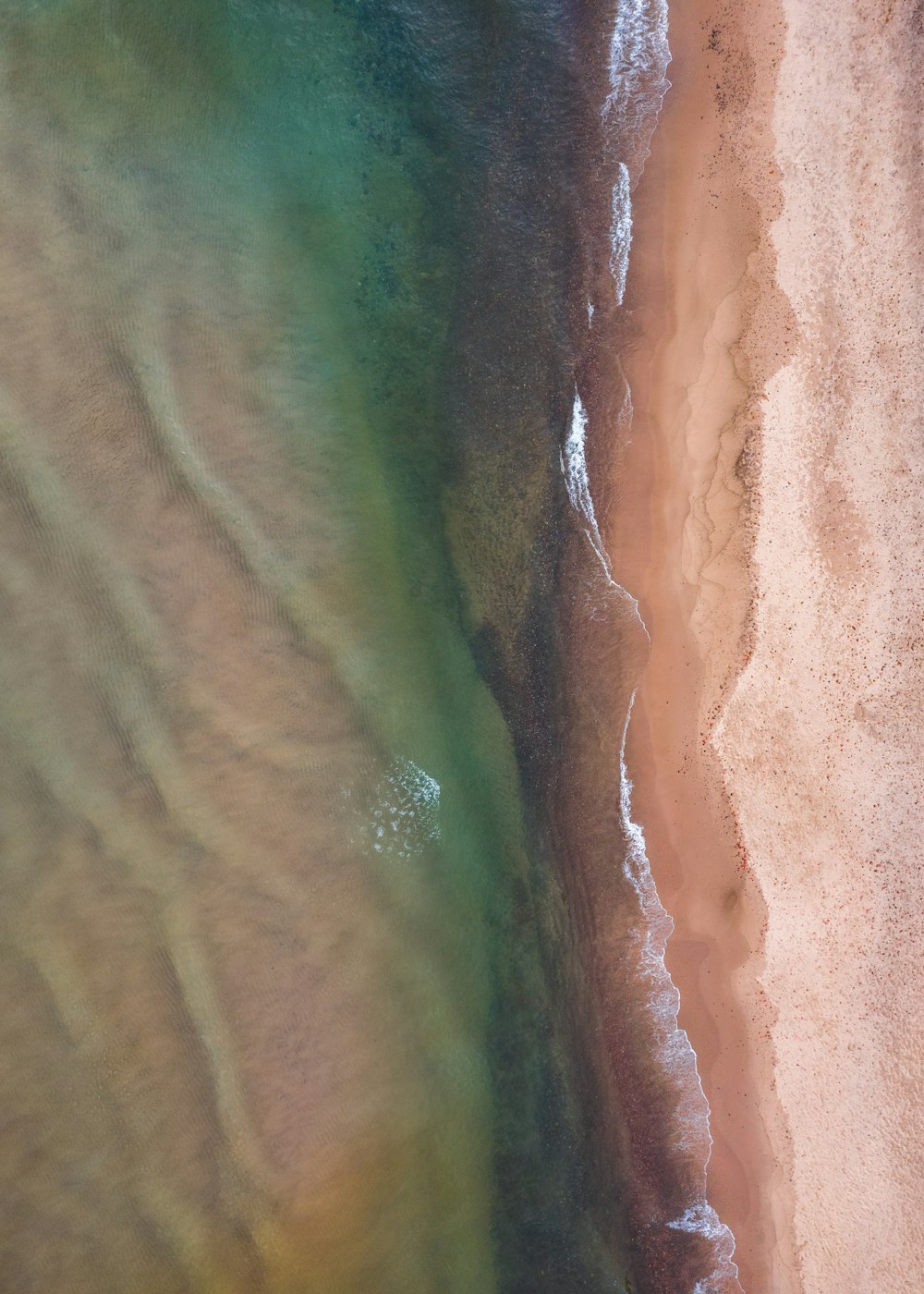 a bird's eye view of a beach and ocean