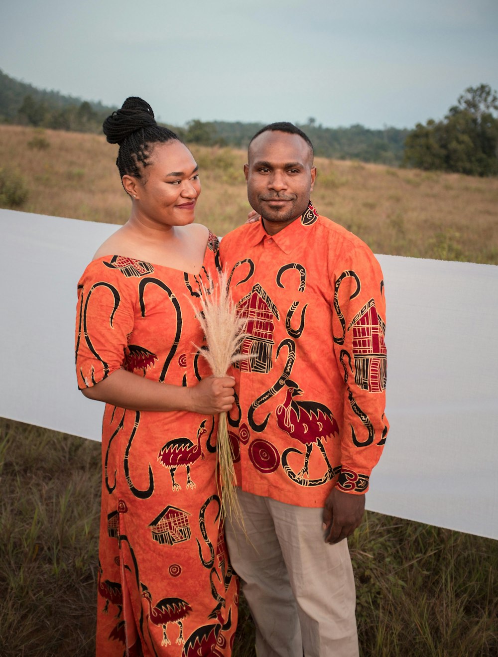 a man and a woman standing next to each other