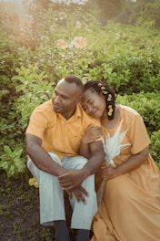 a man and a woman sitting next to each other