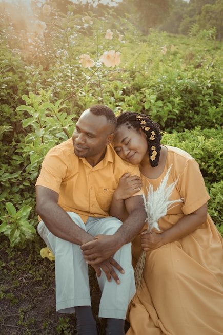 a man and a woman sitting next to each other