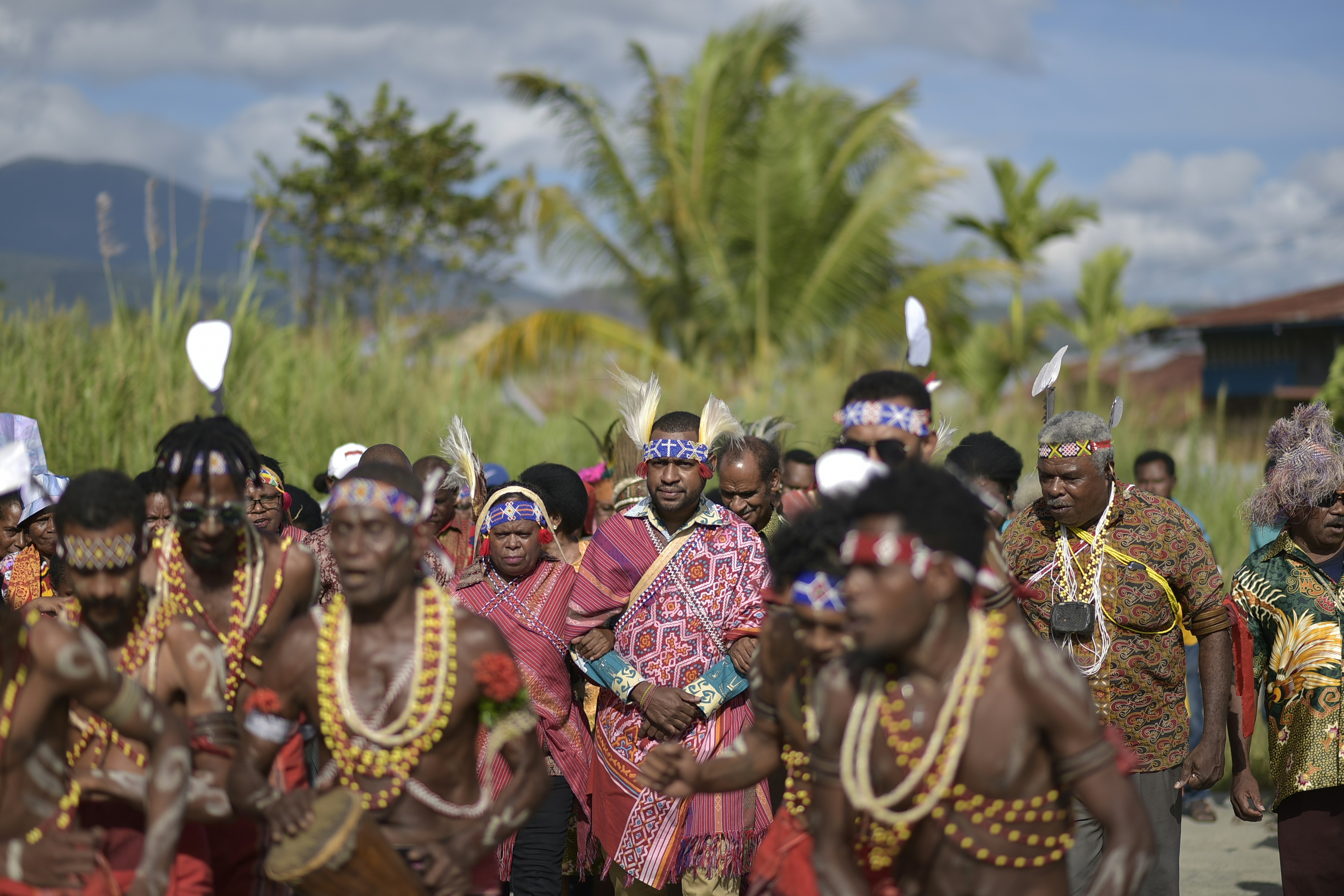 a group of people dressed in native clothing