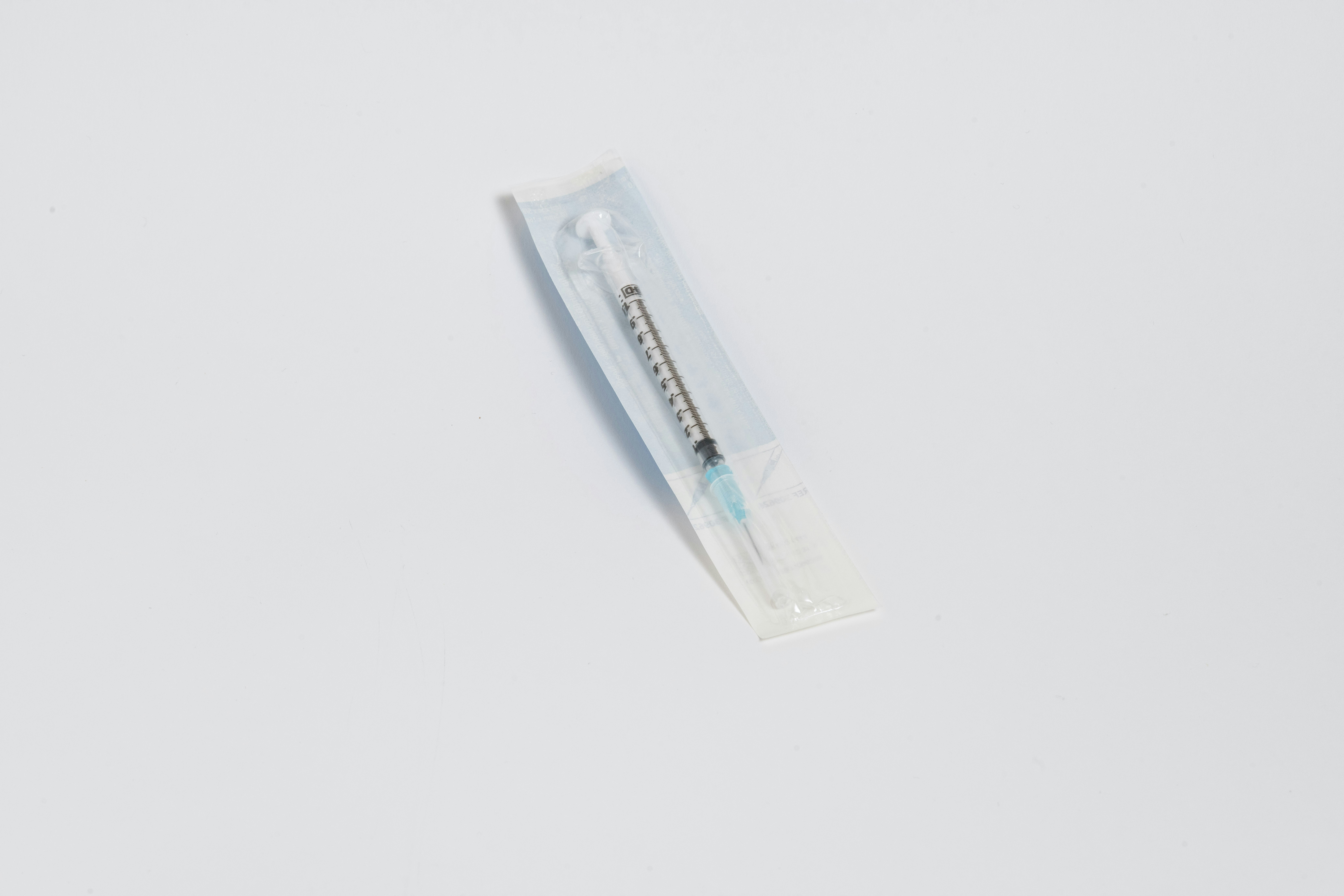 a toothbrush in a package on a white surface