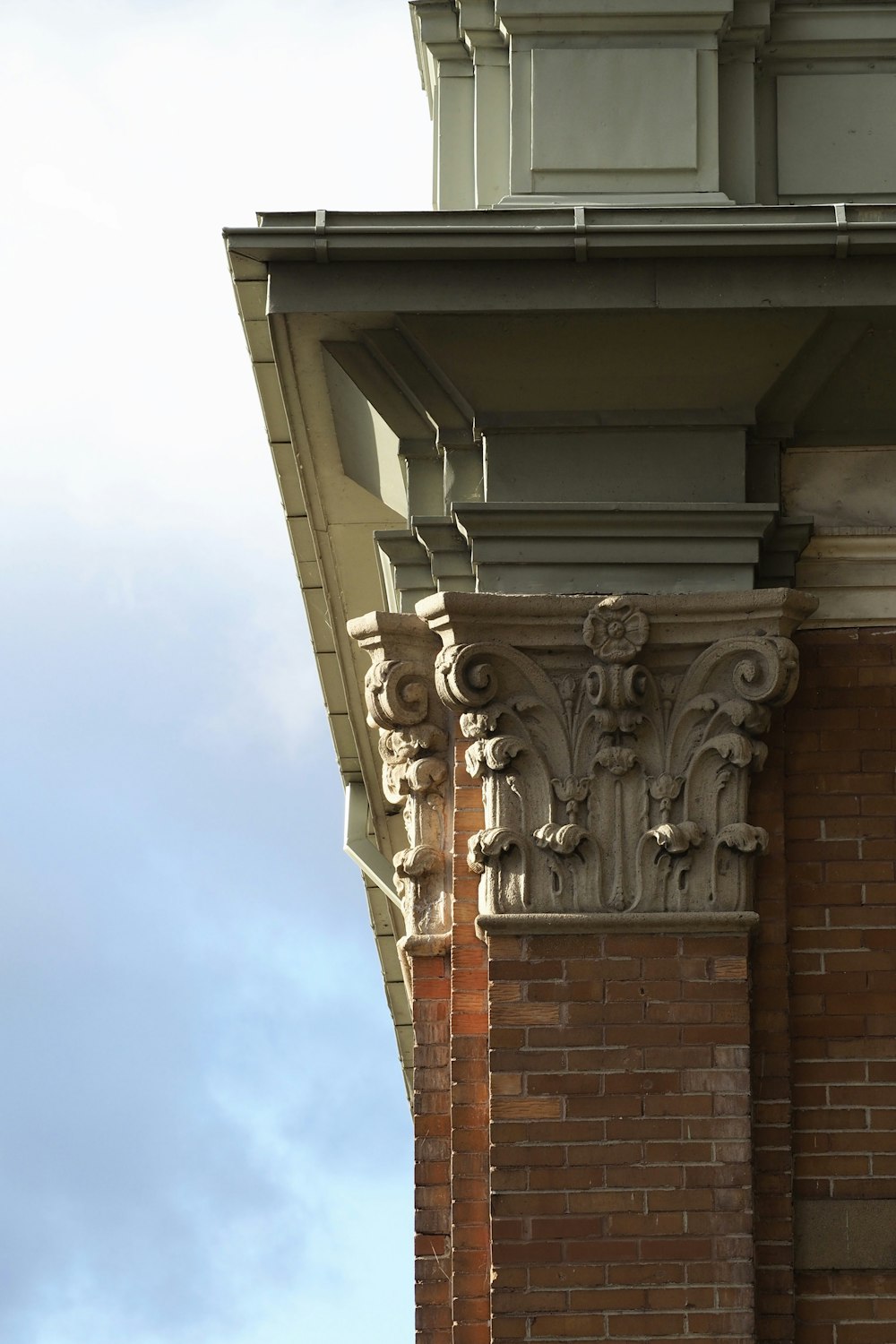 a clock on the side of a brick building