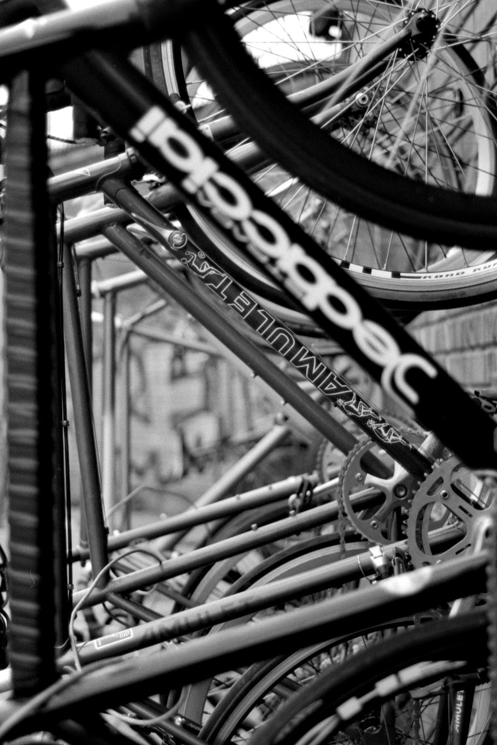 a black and white photo of many bicycles