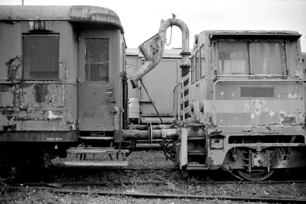 a black and white photo of old train cars