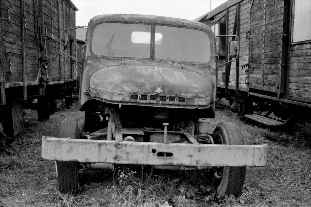 a black and white photo of an old truck