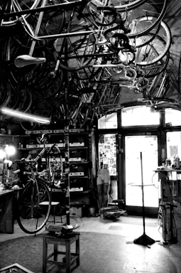 A cozy bike workshop corner with tools and a vintage bicycle on a stand.