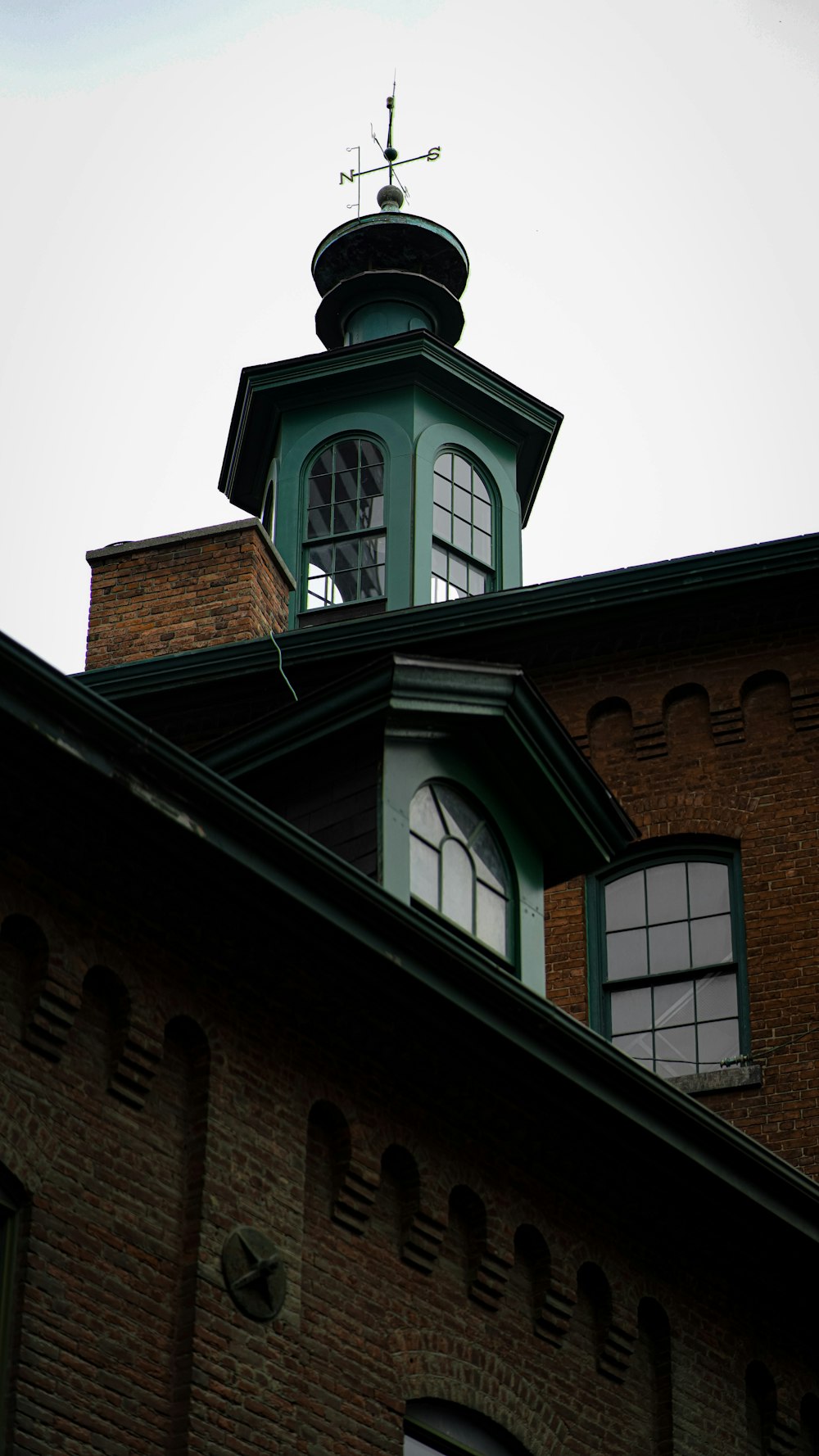 a clock tower on top of a brick building
