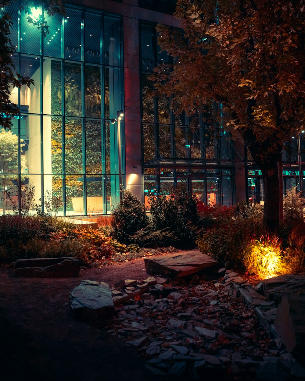 a building lit up at night with a lot of windows