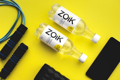 a couple of bottles of water sitting on top of a table
