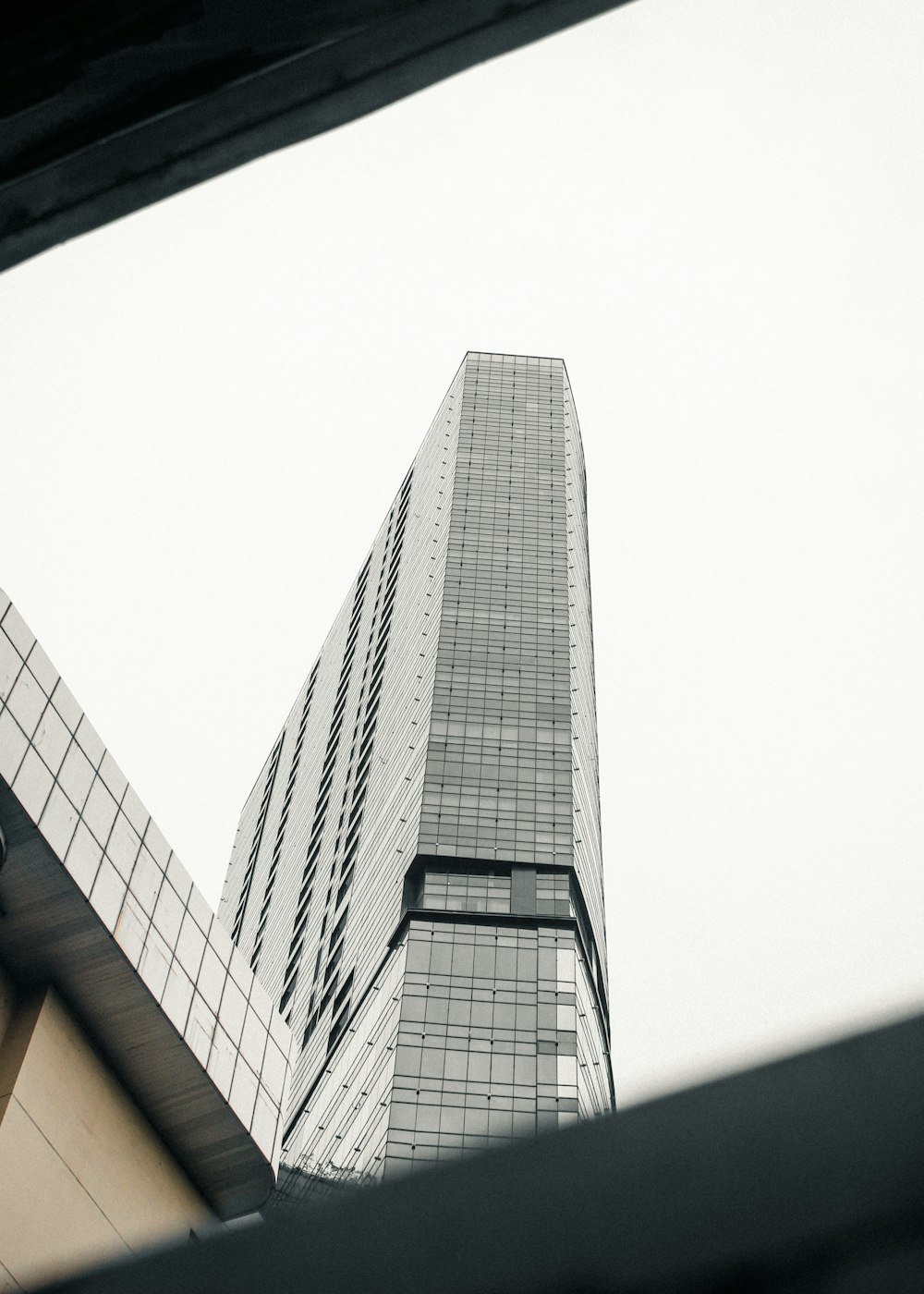 a very tall building towering over a city