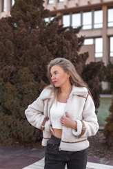 a woman standing in front of a building