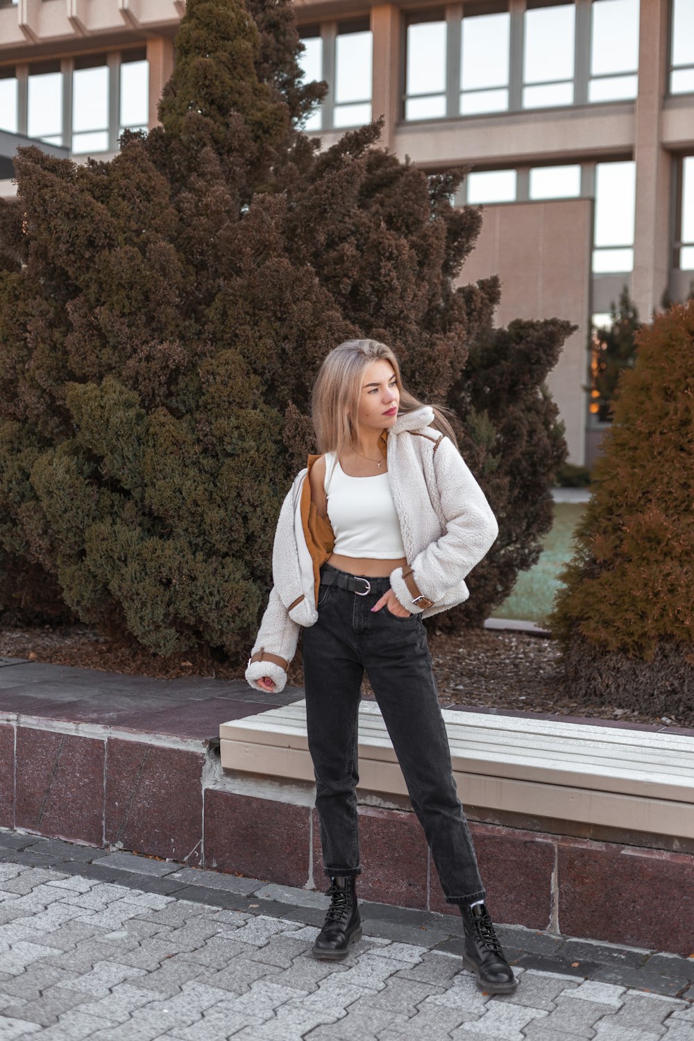 a woman standing in front of a building