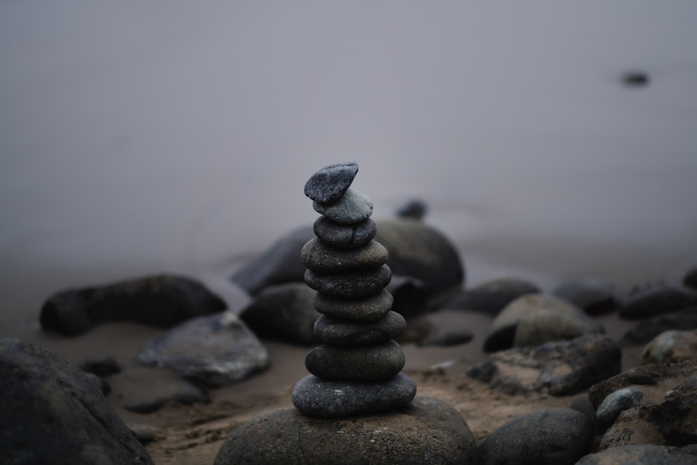 a stack of rocks sitting on top of a beach