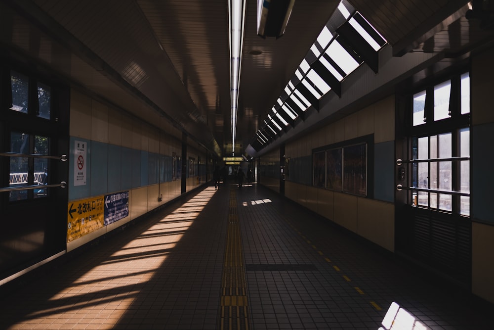 a train station with a long line of windows