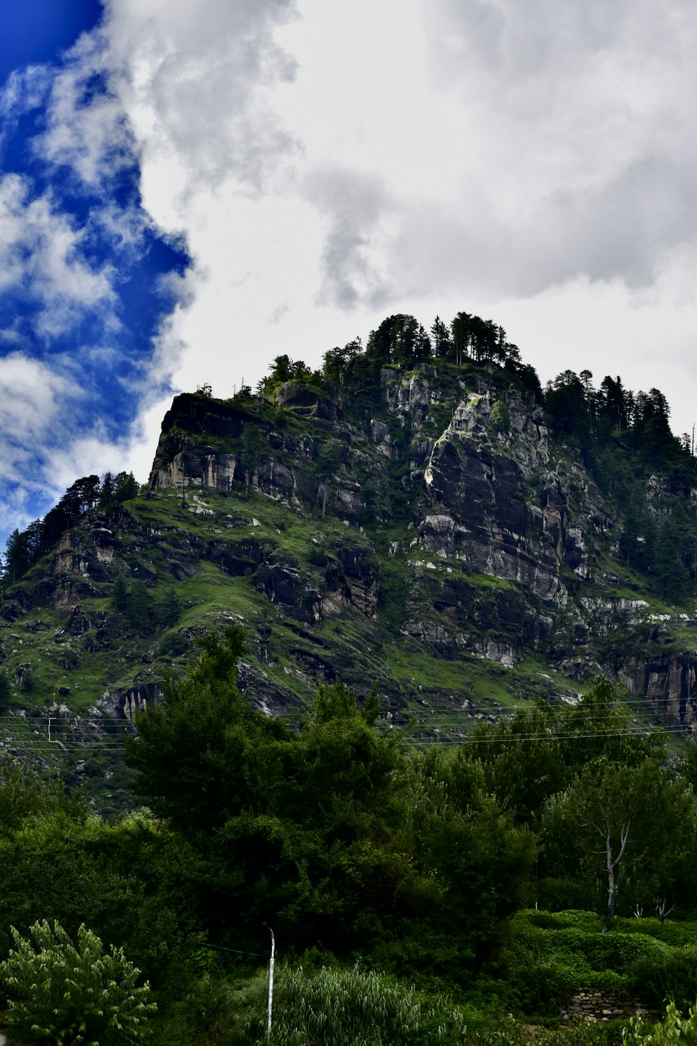 a very tall mountain with a sky background