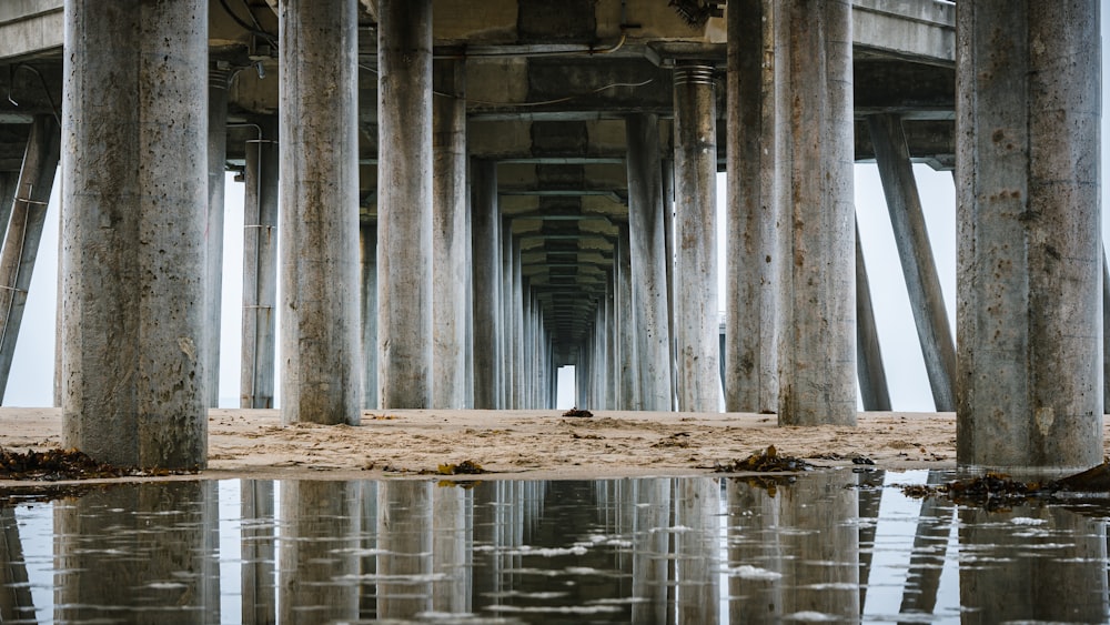 a view of the underside of a pier from the water