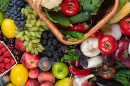 a pile of assorted fruits and vegetables sitting next to each other