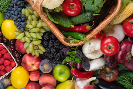 a pile of assorted fruits and vegetables sitting next to each other