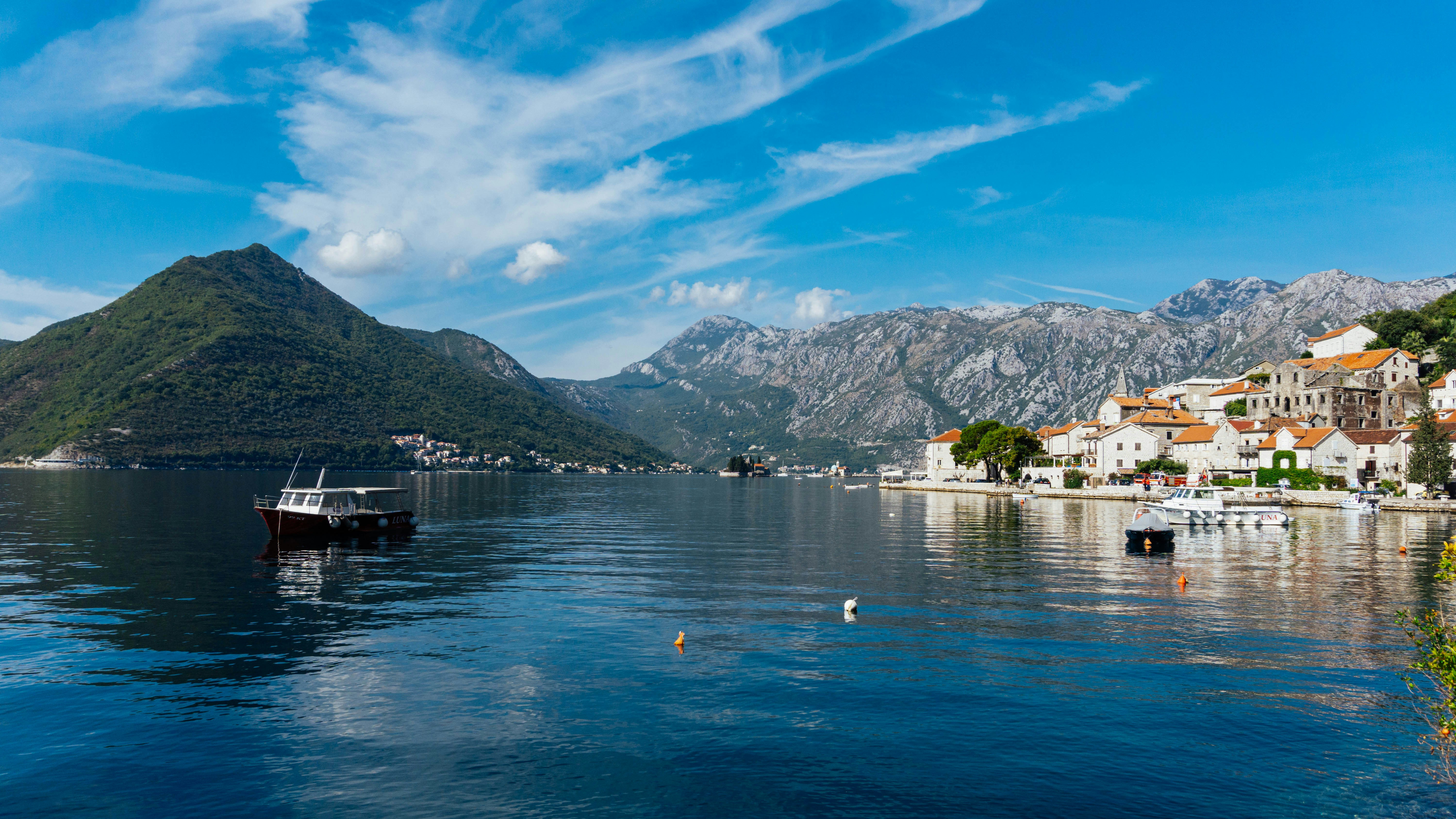 a boat floating on top of a large body of water, 