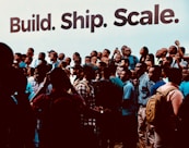 a group of people standing in front of a building