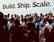 A large group of people are gathered together, many of them holding or using smartphones, suggesting an event or gathering. The backdrop features the words 'Build. Ship. Scale.' in large bold letters, indicating a tech or entrepreneurial theme. The crowd consists of individuals dressed casually and engaging with each other, capturing a sense of community and interaction.