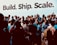 A large group of people are gathered together, many of them holding or using smartphones, suggesting an event or gathering. The backdrop features the words 'Build. Ship. Scale.' in large bold letters, indicating a tech or entrepreneurial theme. The crowd consists of individuals dressed casually and engaging with each other, capturing a sense of community and interaction.
