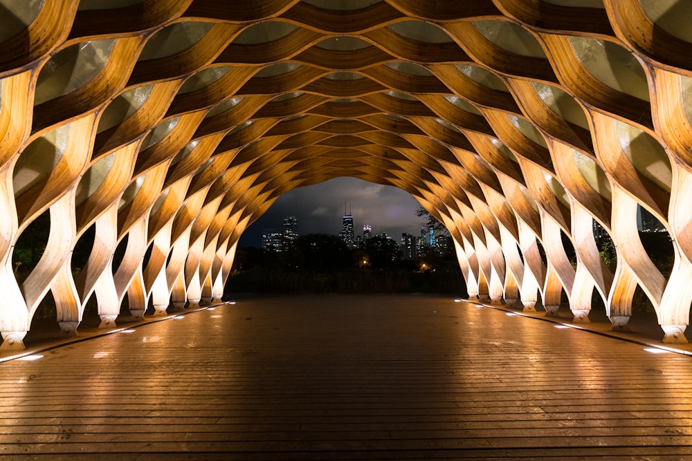 a large wooden structure with lights on it