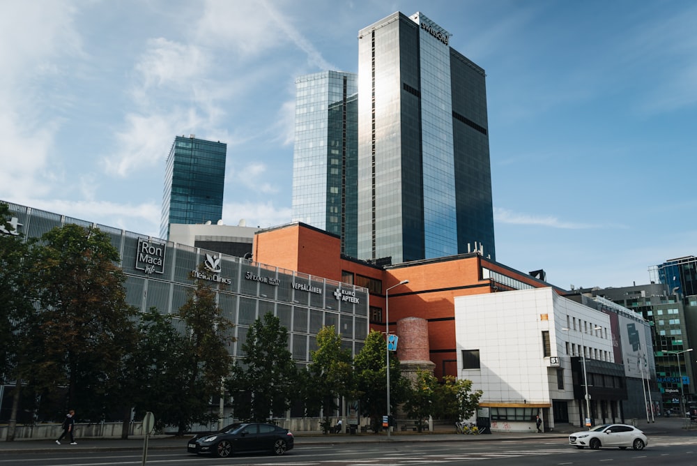 a city with tall buildings and cars on the street