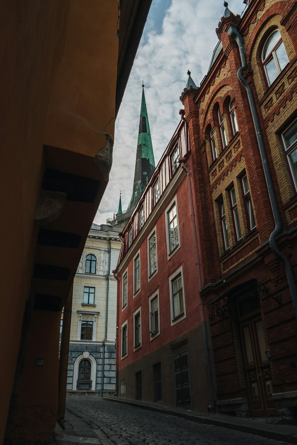 a view of a street with buildings and a clock tower