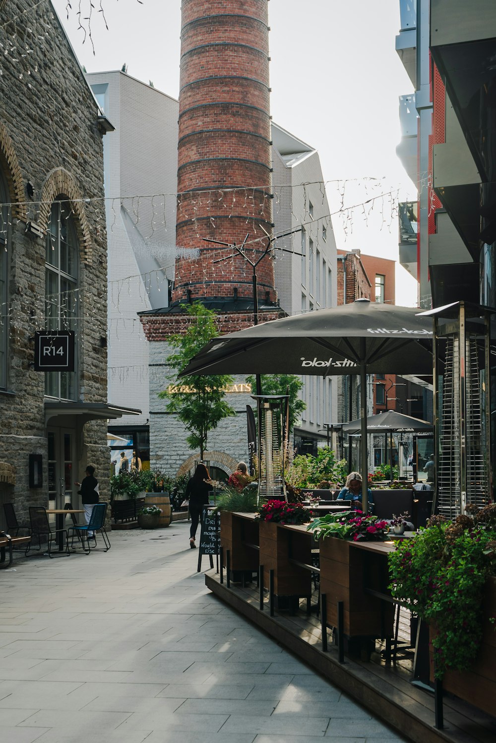 a brick building with a clock tower in the background