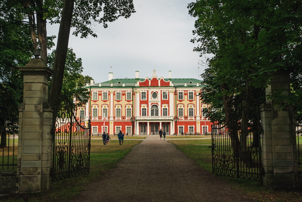 a red and white building surrounded by trees