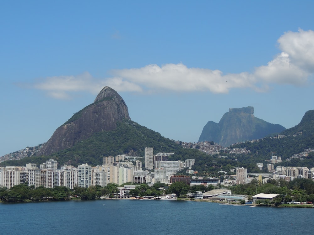 a large body of water with a city in the background