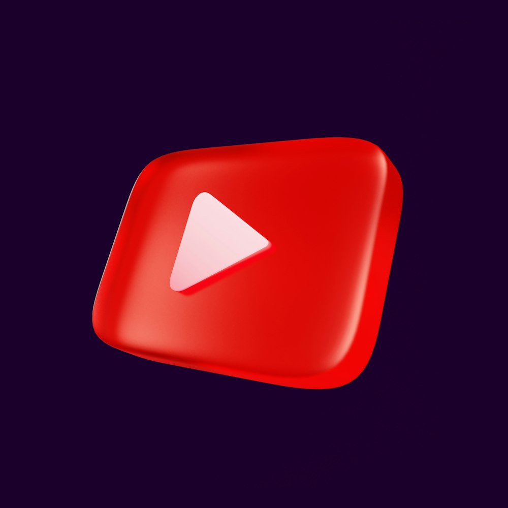 ein roter Play-Button mit einem weißen Pfeil