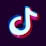 A three-dimensional logo featuring a stylized musical note symbol with vibrant neon colors, including blue, red, and white. The symbol has a glossy finish and stands out against a dark purple background.